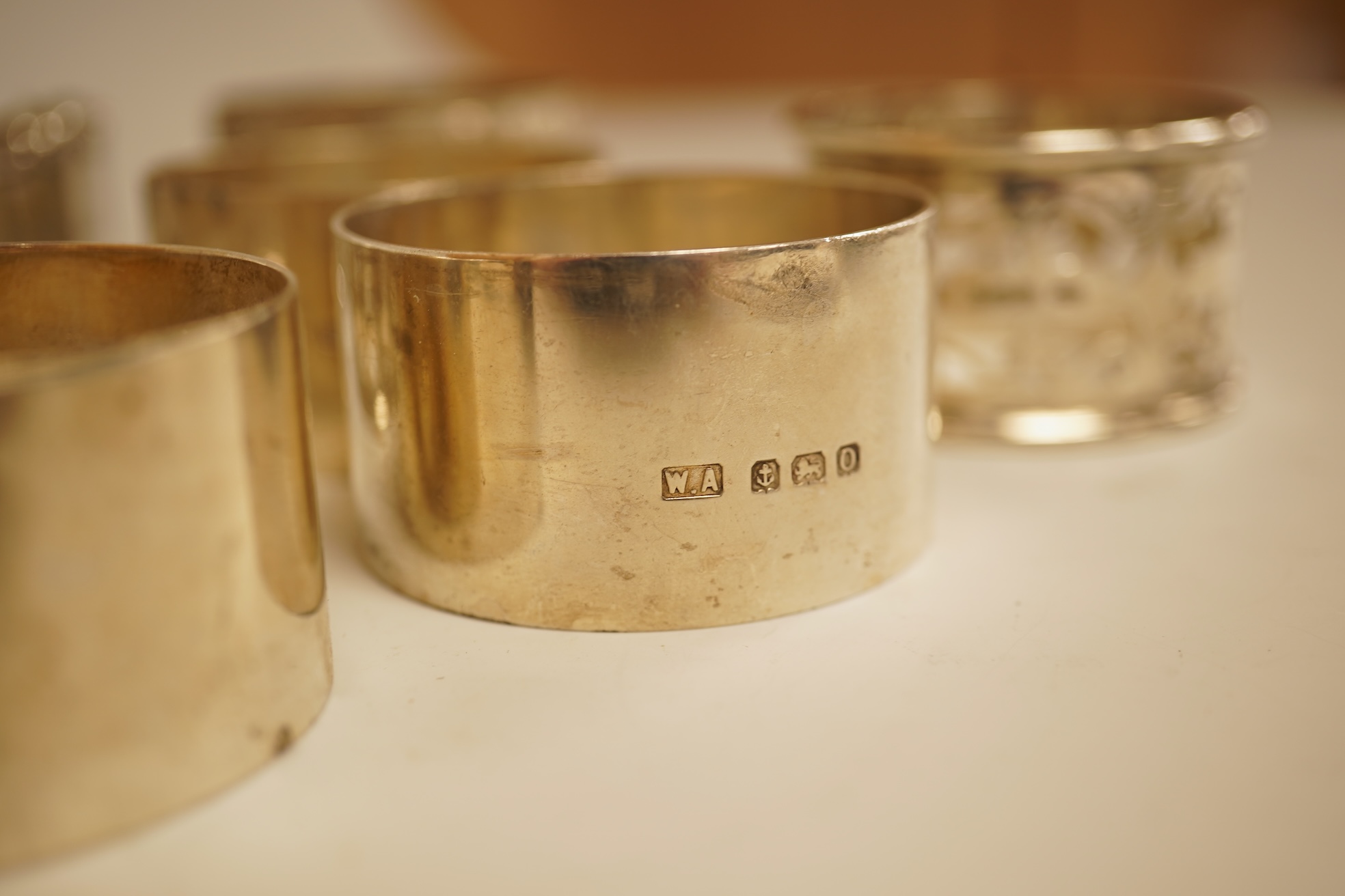 A pair of Edwardian pieced silver napkin rings by Henry Wigfull, Sheffield, 1905, together with nine other assorted silver napkin rings.